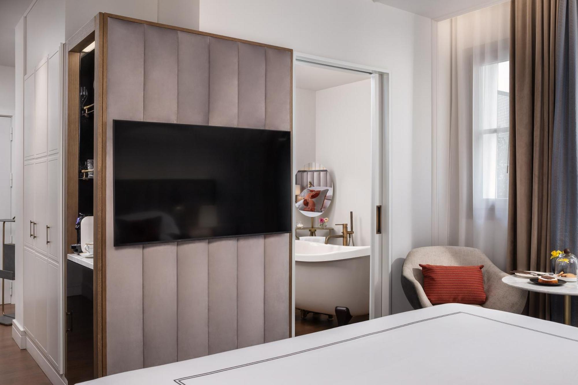 Gran Hotel Ingles - The Leading Hotels Of The World Madrid Exterior photo A television concealed behind a sliding door
